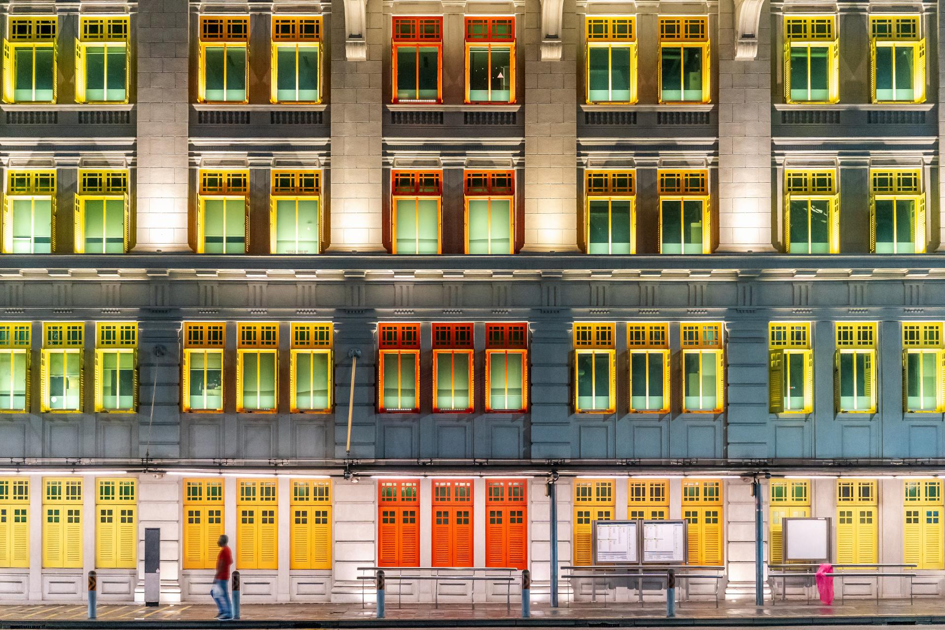 The Old Hill Street Police Station at night, building with colourful windows