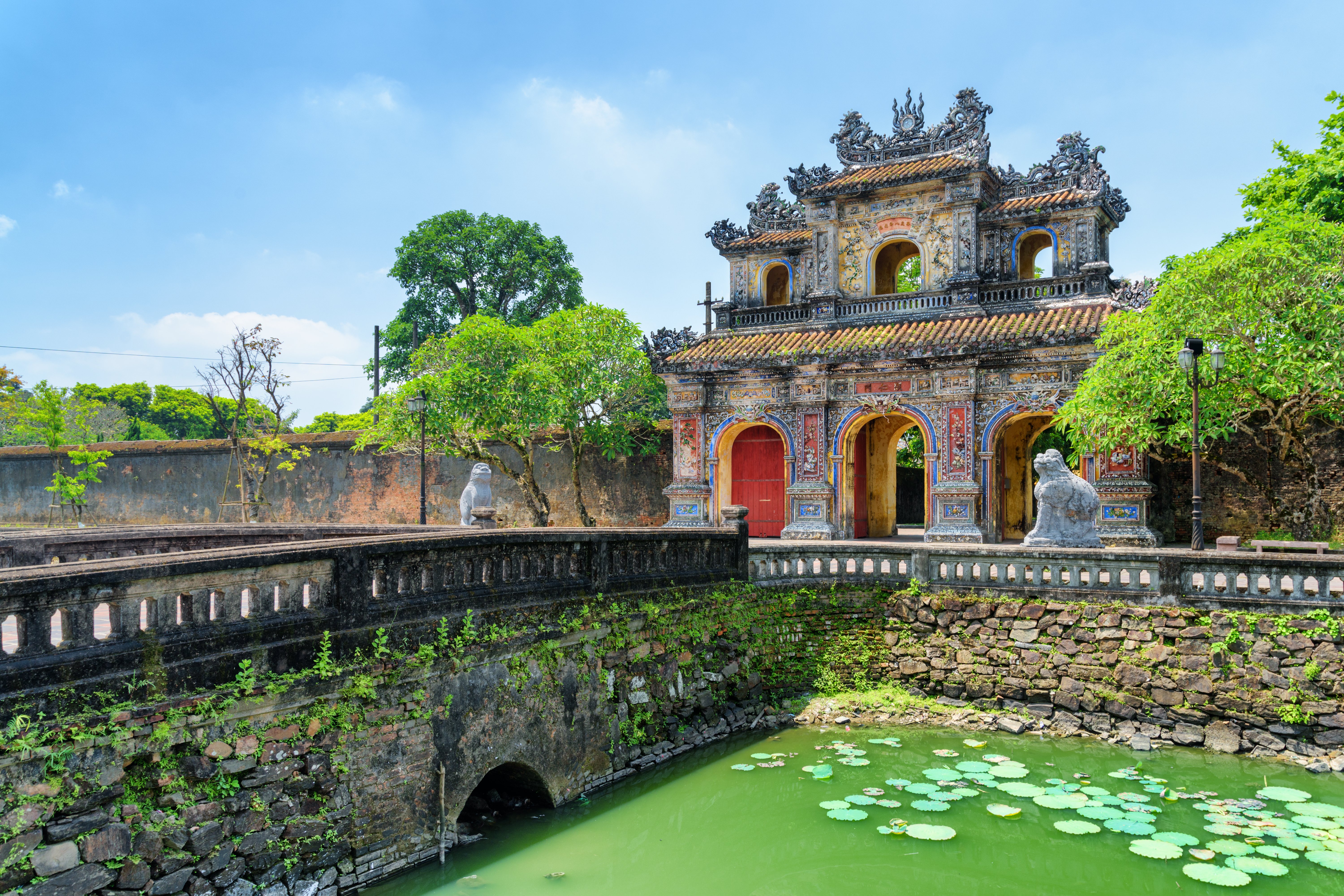Wonderful view of the East Gate (Hien Nhon Gate) to the Citadel and a moat surrounding the Imperial City with the Purple Forbidden City.
